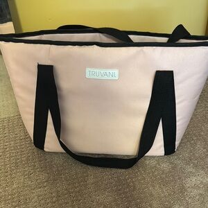 Pink Tote with 8 TrUvaNi single organic plant based protein powders as ShOWn